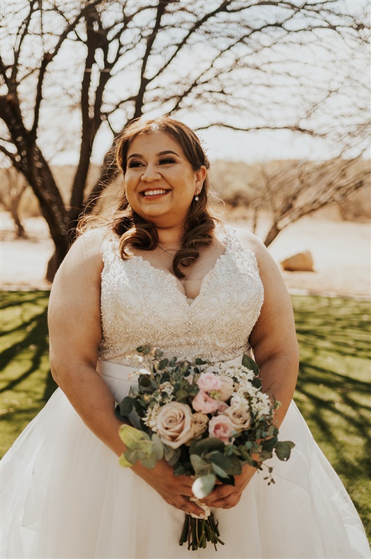 bride holding wedding flowers