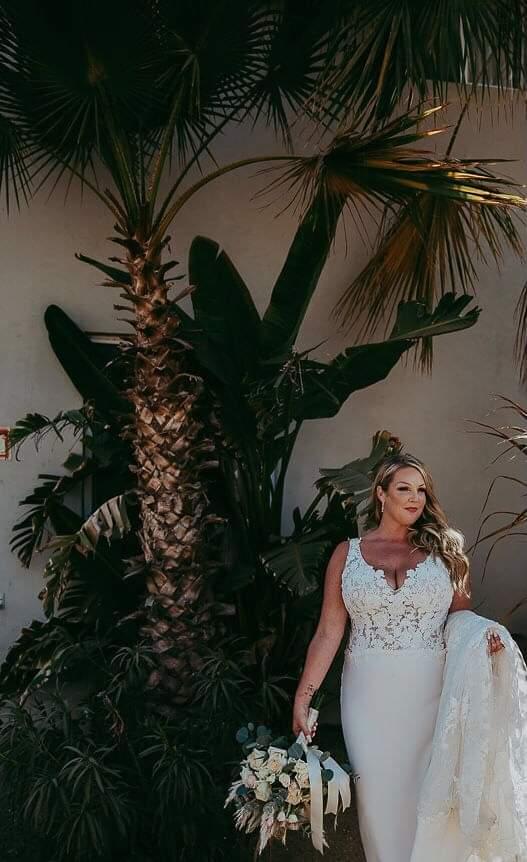 bride wearing sexy beach wedding dress in crepe