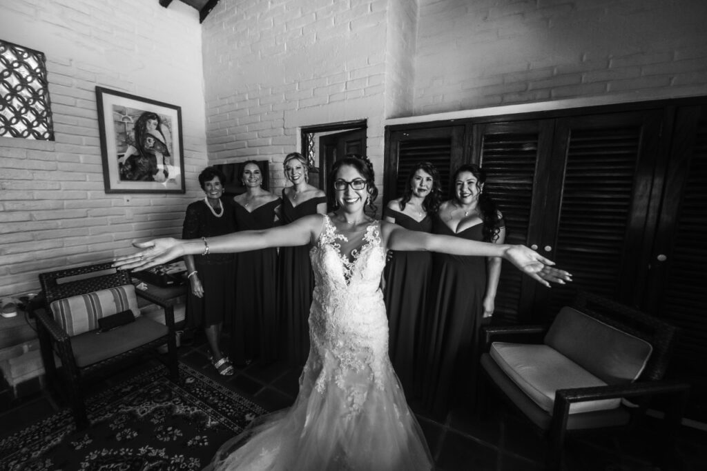 bride with bridesmaids getting ready