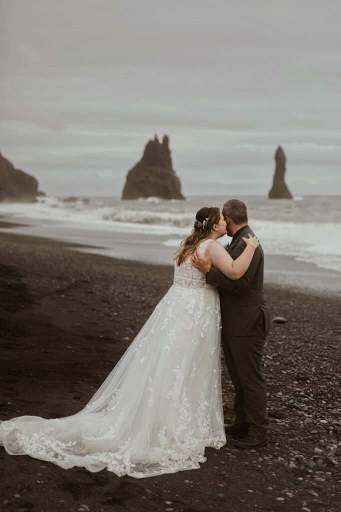 bride and groom at beach in iceland