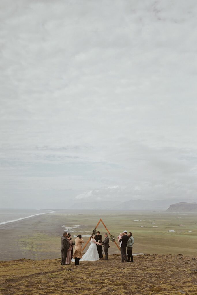 bride and groom at mountain in iceland