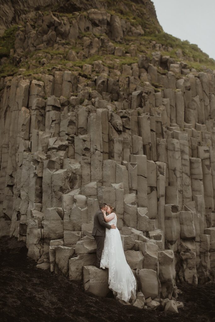 bride and groom at mountain in iceland