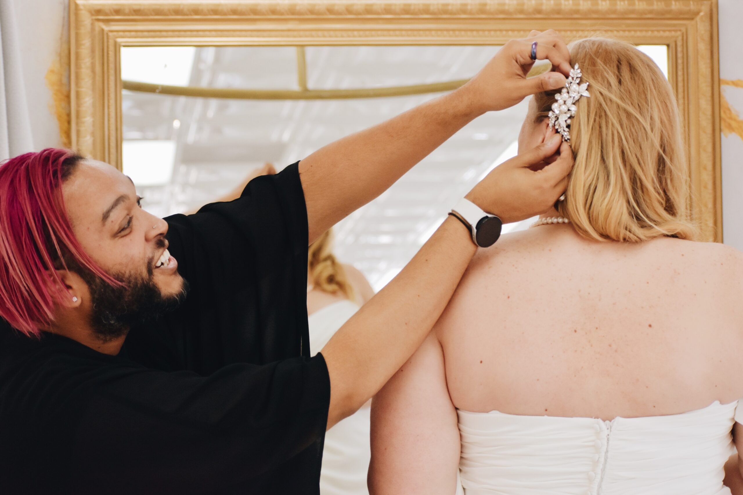 bridal stylist putting headpiece on bride phoenix arizona bridal shop