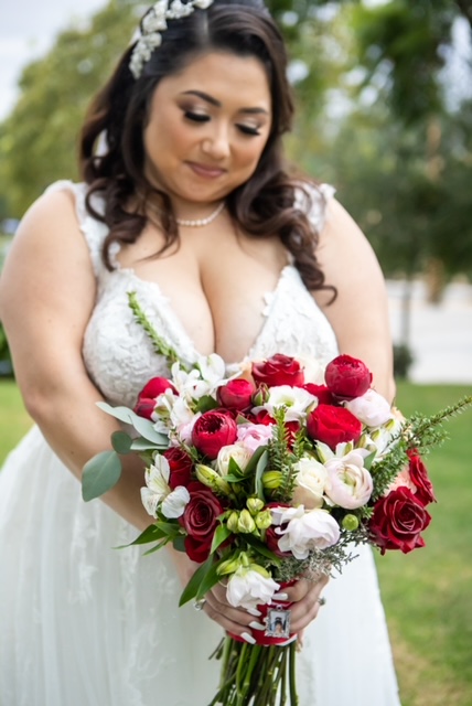 plus size bride in glitter ballgown holding wedding bouquet long beach california