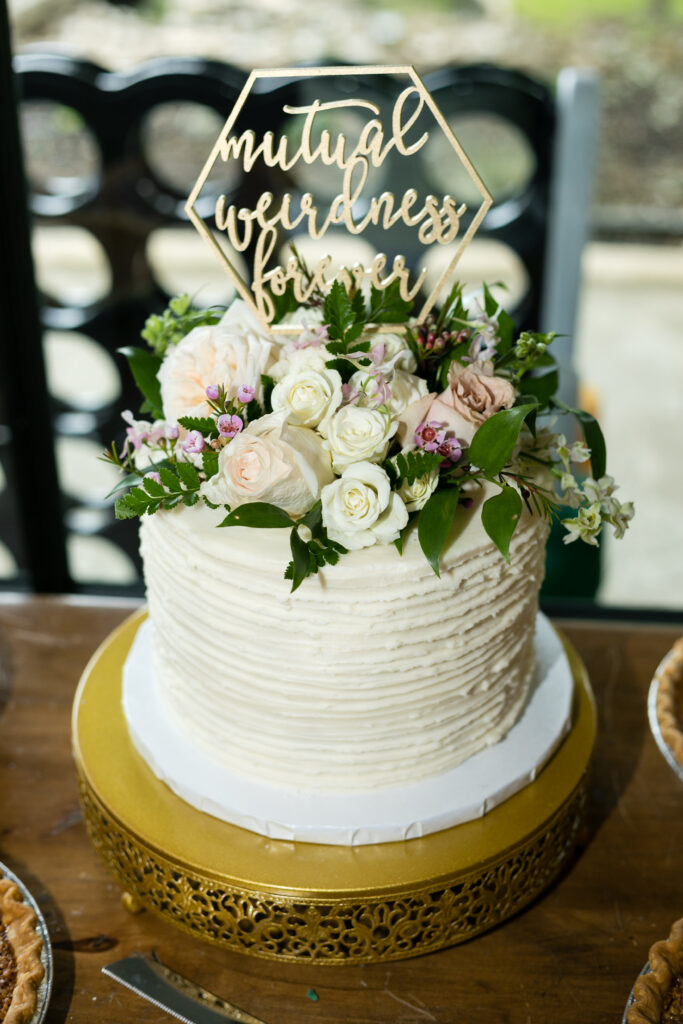 wedding cake with fun custom topper