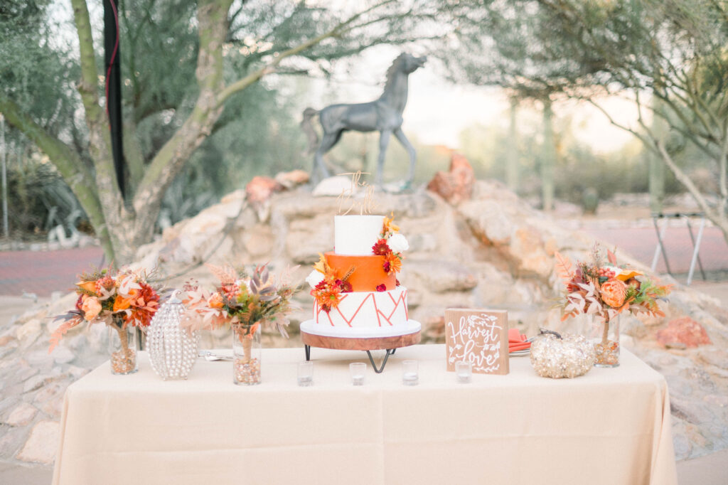 unique orange wedding cake table