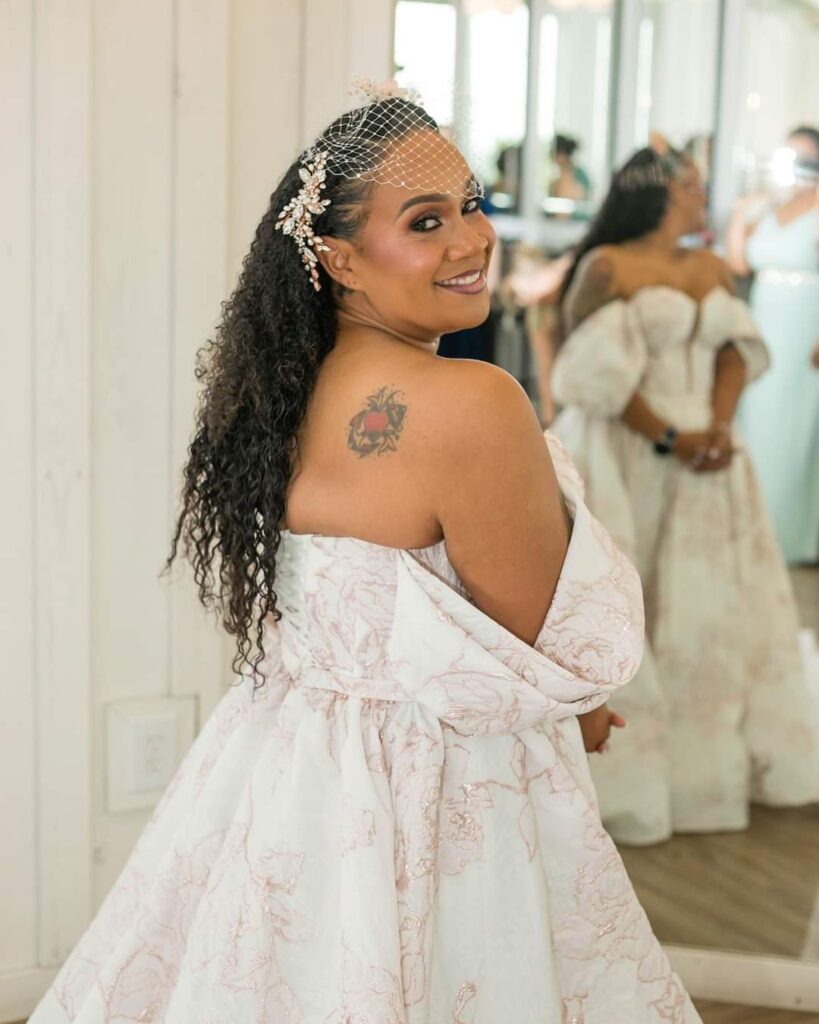 mid size wearing unique pink floral print wedding dress los angeles california bridal shop