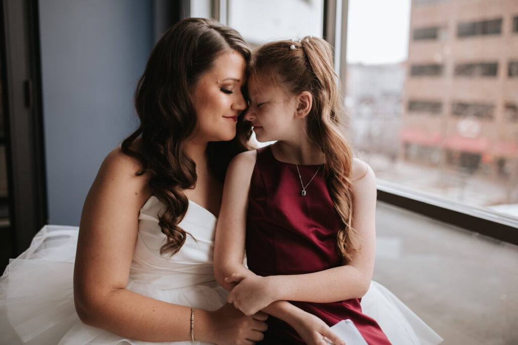 bride with daughter in red dress