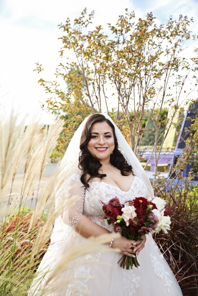 plus size bride wearing off the shoulder aline wedding dress angeles california