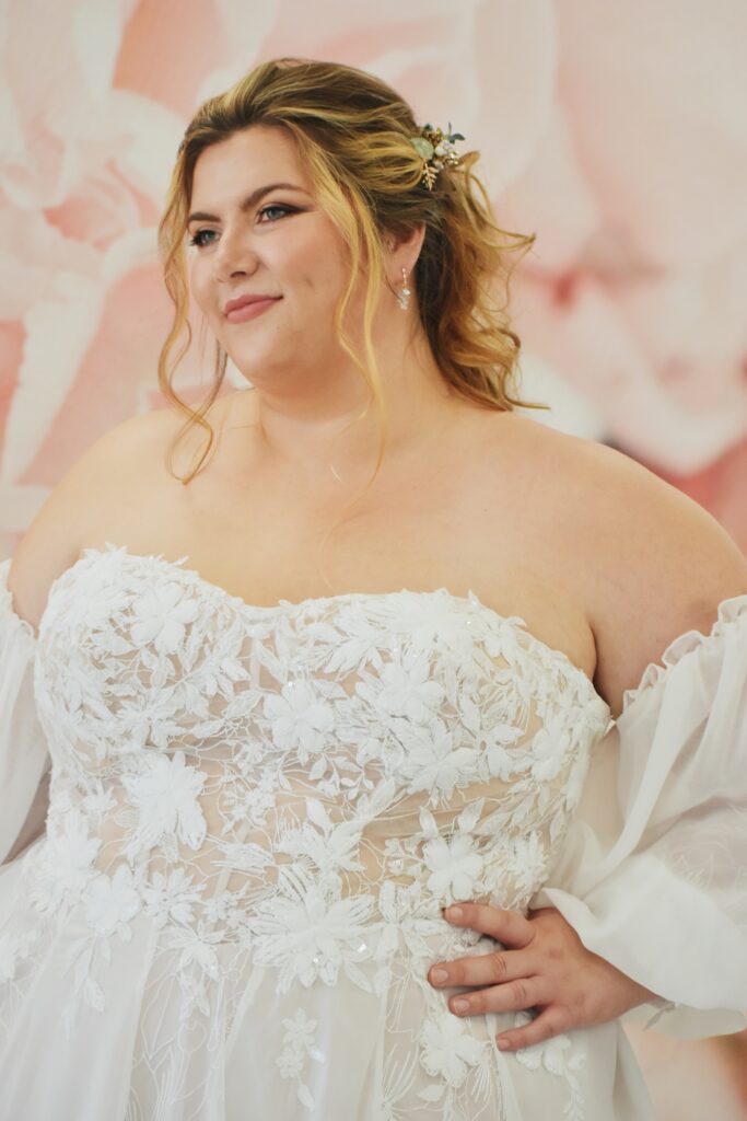 plus size bride in plus size wedding dress with sleeves phoenix arizona bridal store