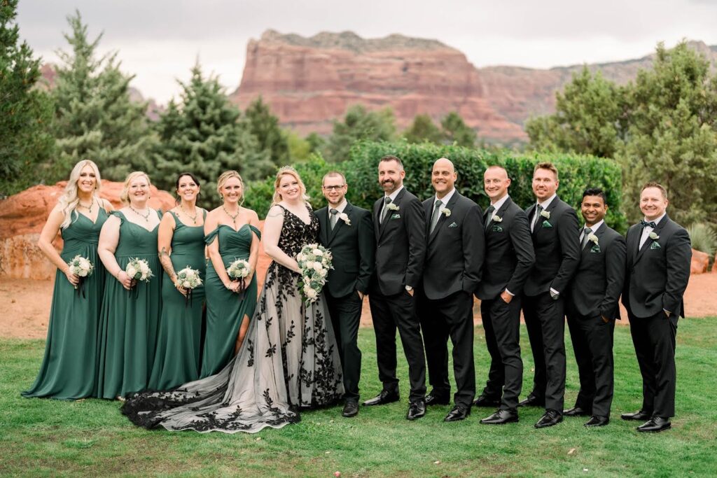 large bridal party with bride wearing two tone lace aline wedding dress, groom in black tux in sedona arizona