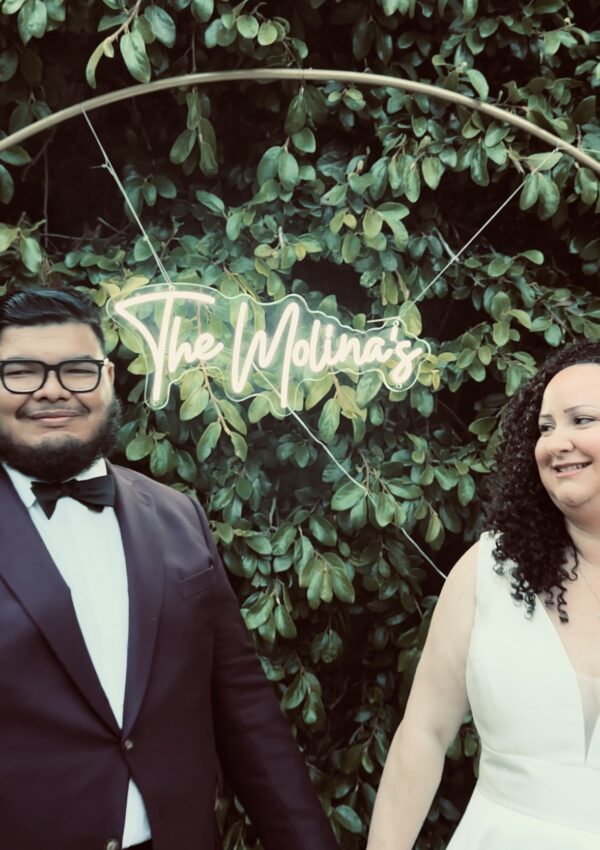 plus size bride wearing vneck mikado wedding dress groom in suit at woodsy park