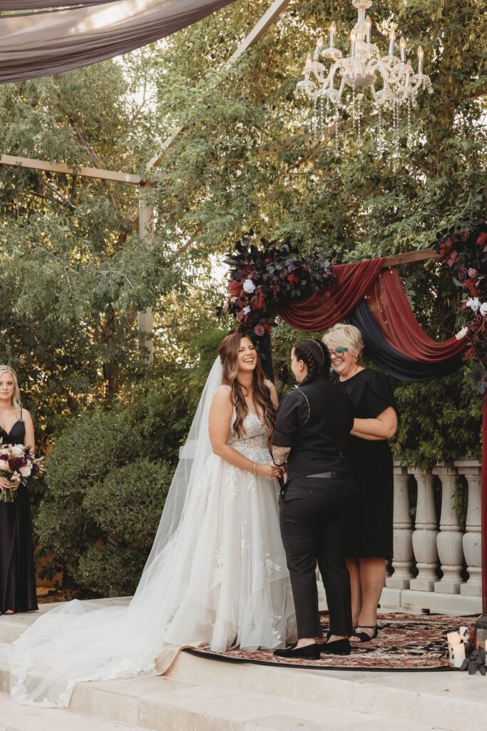 bride wearing off the rack ruffled aline wedding dress with bride in black tux