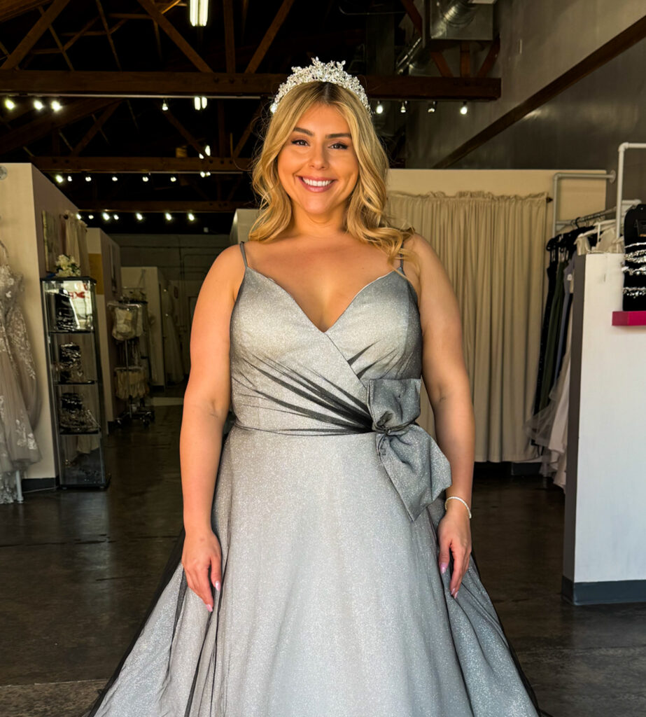 woman wearing plus size aline off the rack wedding dress under 1000 in long beach california bridal shop