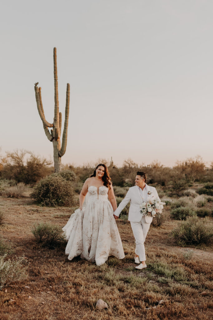 LGBTQIA couple walking in desert phoenix arizona